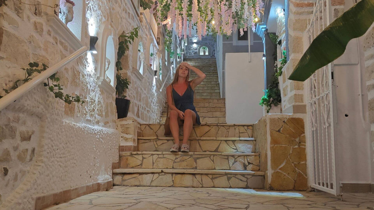A woman is sitting on the stairs