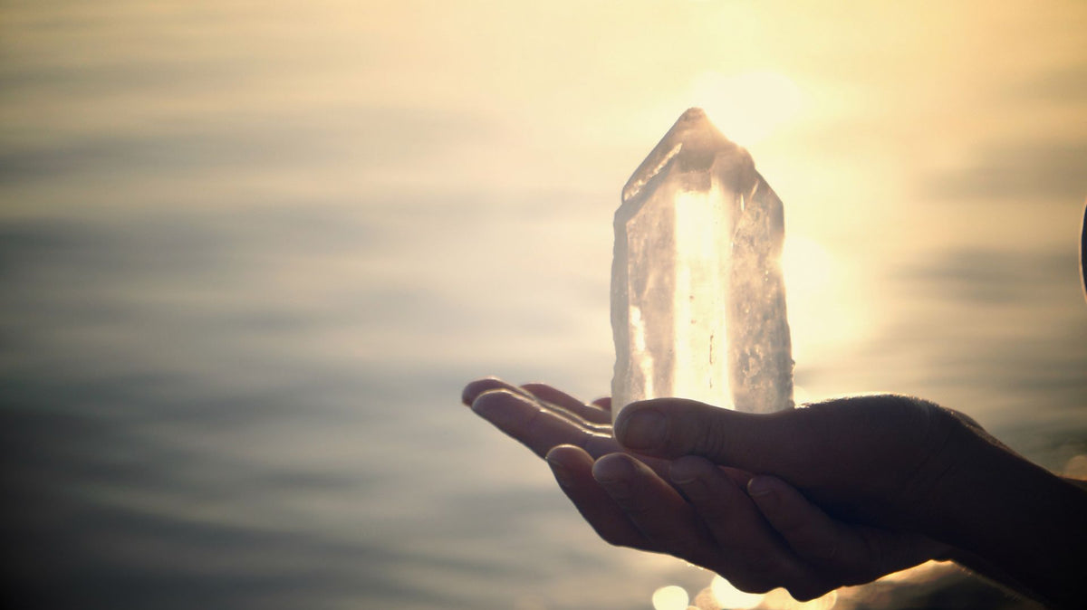 Woman is holding a crystal tower