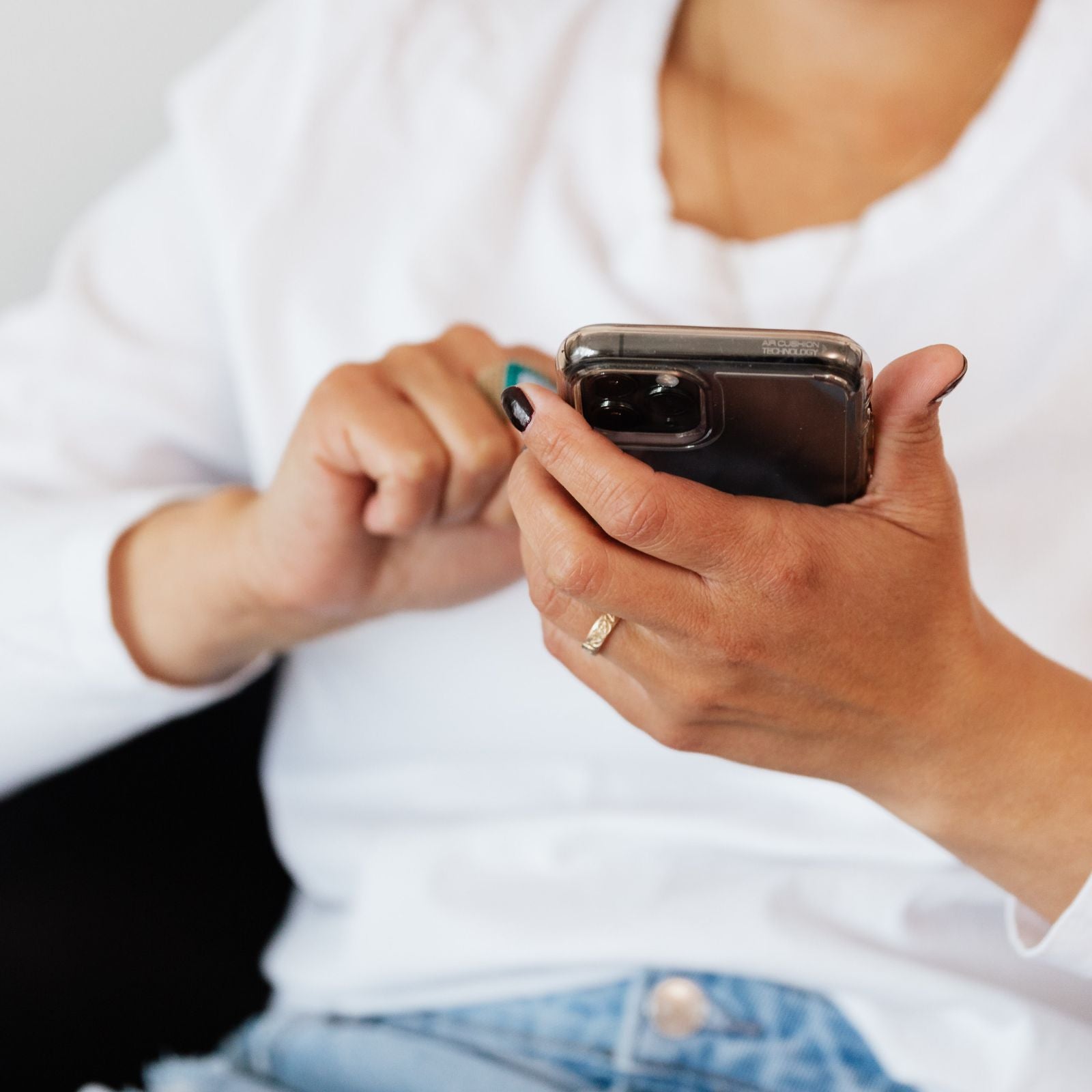 woman is scrolling her phone