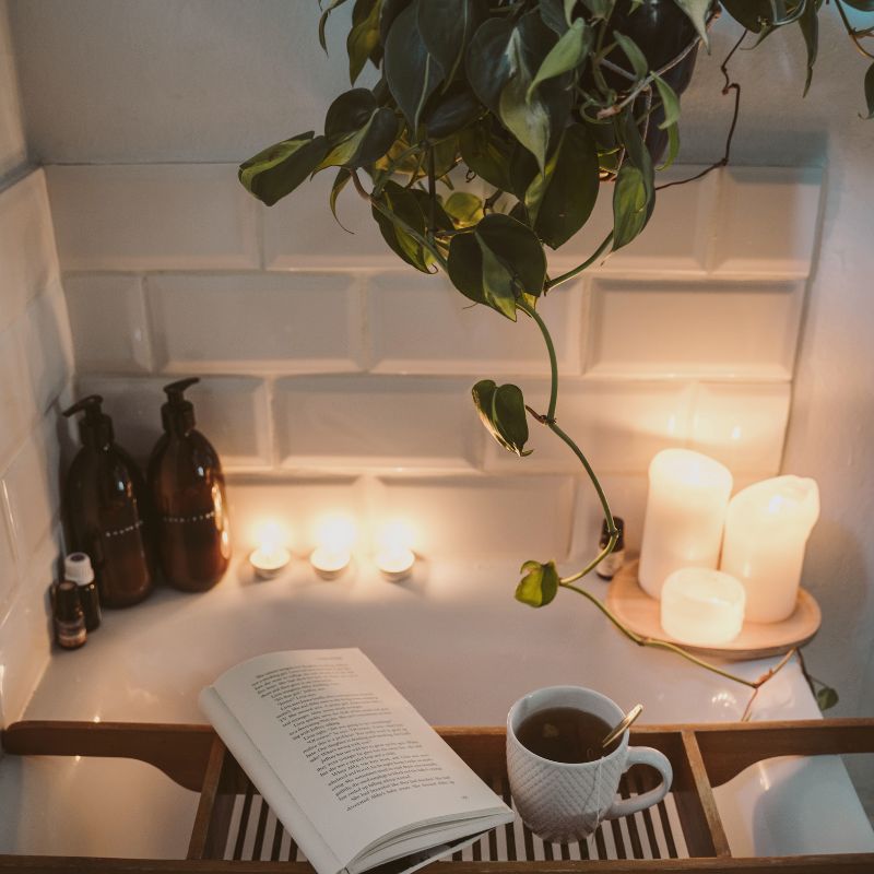 a cozy bath with tea and book