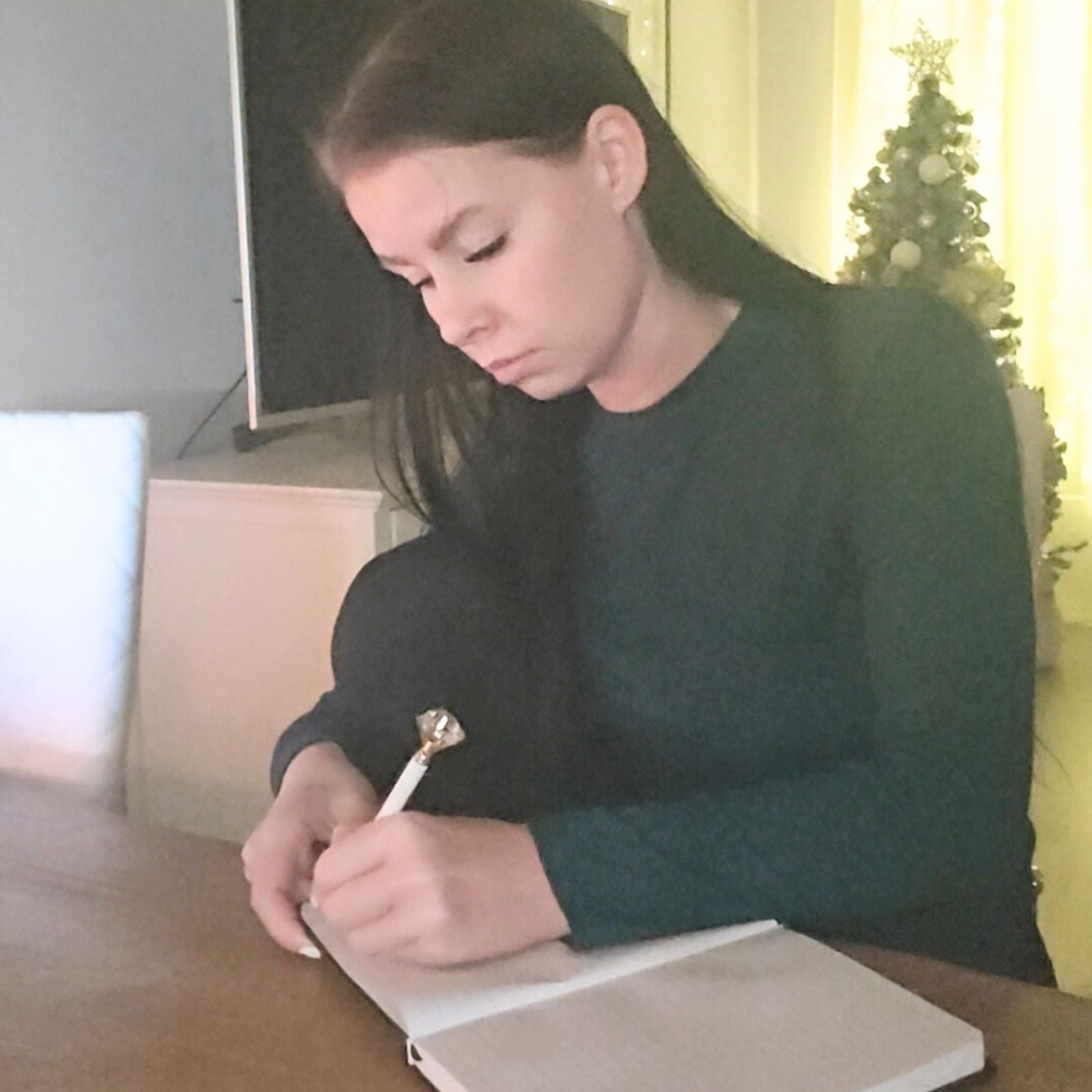 Founder of Wander Balance journaling in a quiet moment, practicing real-life slow living.