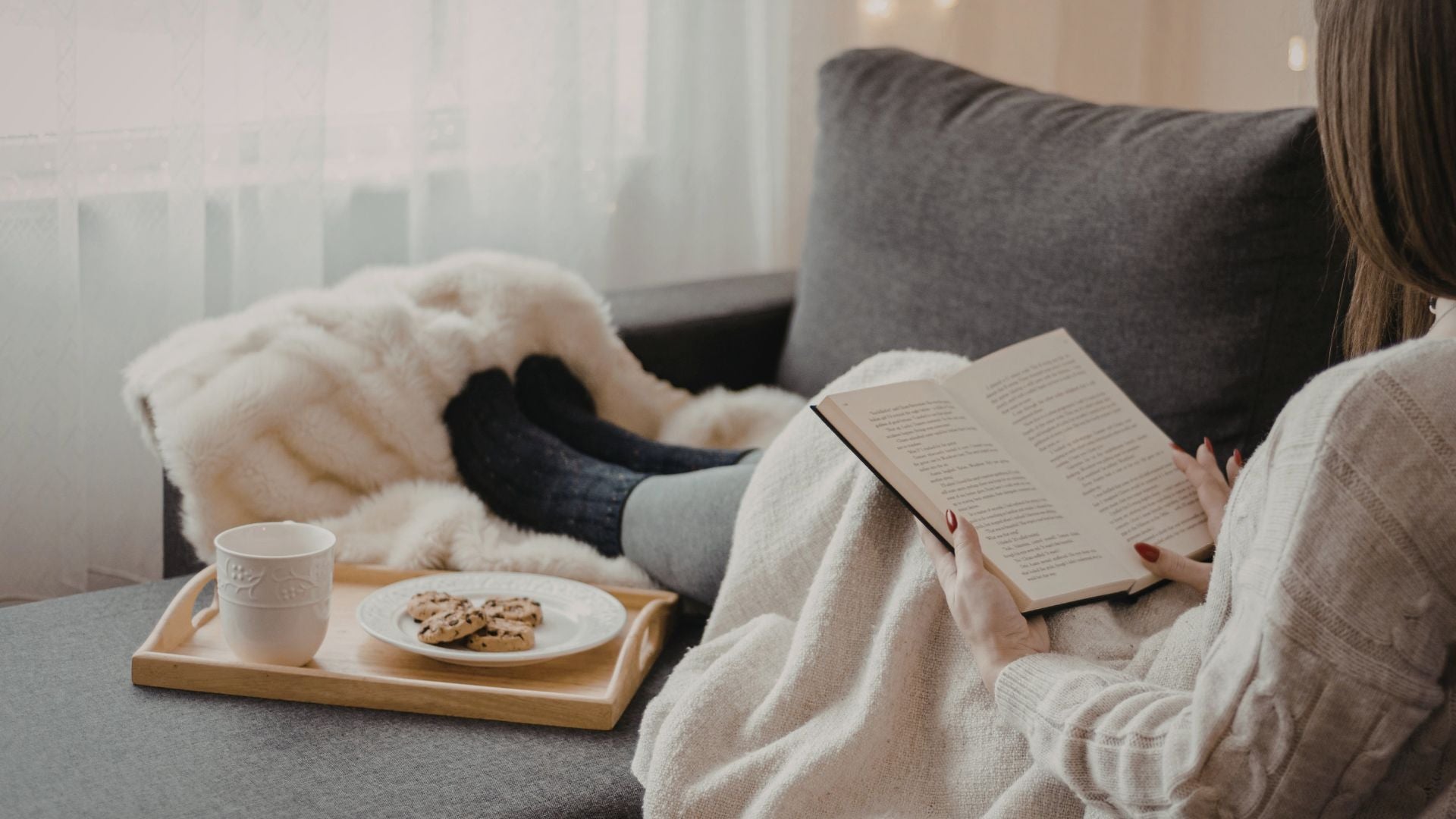 Quiet reading moment at home with tea