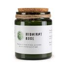 Midnight Rose soy wax candle in green glass jar with wooden wick and cork lid