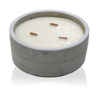 Vanilla and orange soy candle in reusable concrete pot with wooden wick