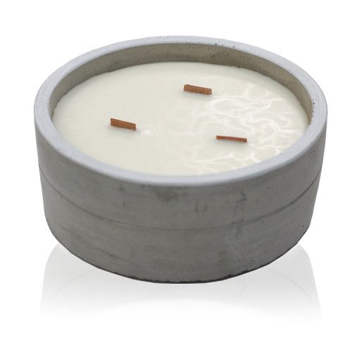 Vanilla and orange soy candle in reusable concrete pot with wooden wick