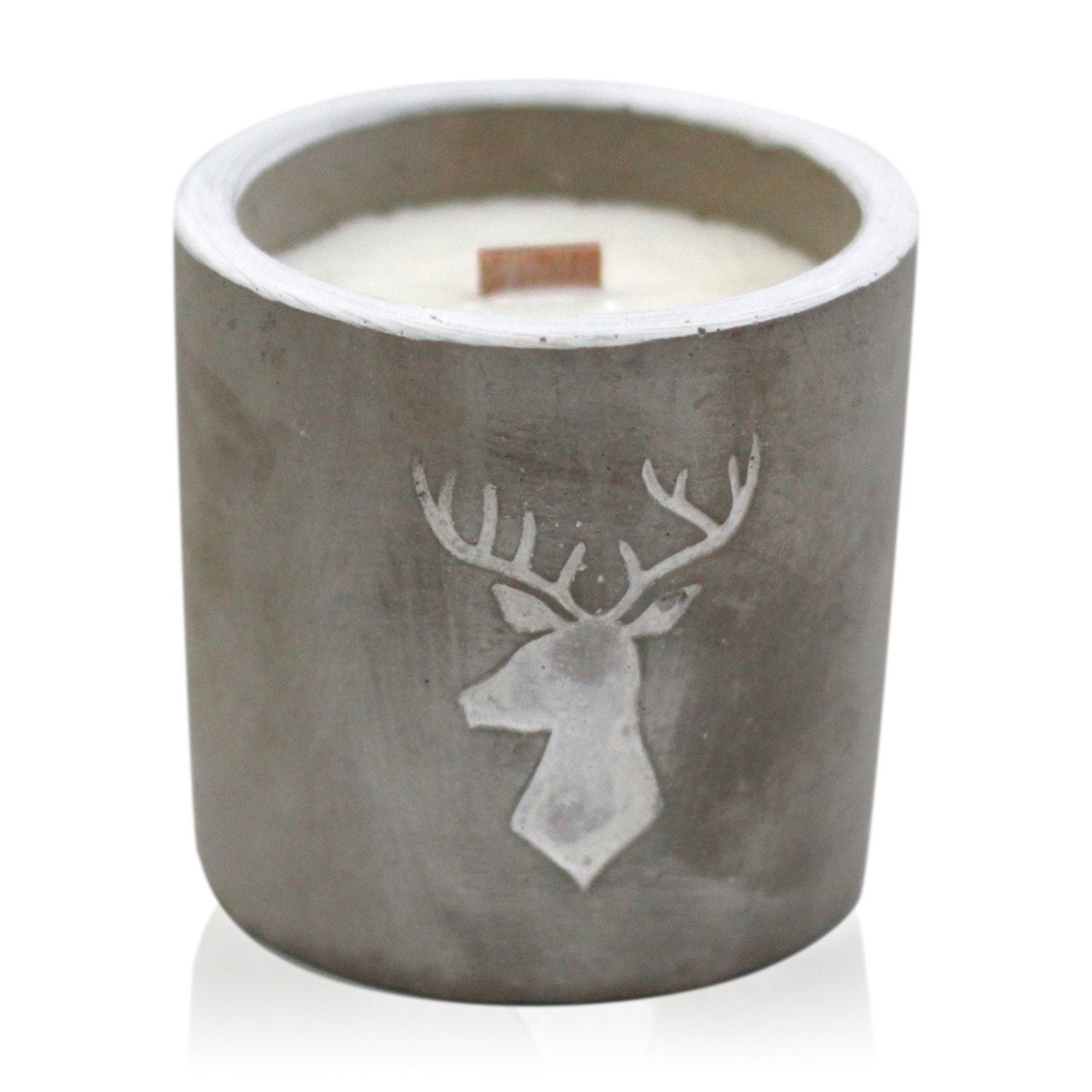 Whiskey and woodsmoke soy candle in raw concrete vessel with wooden wick
